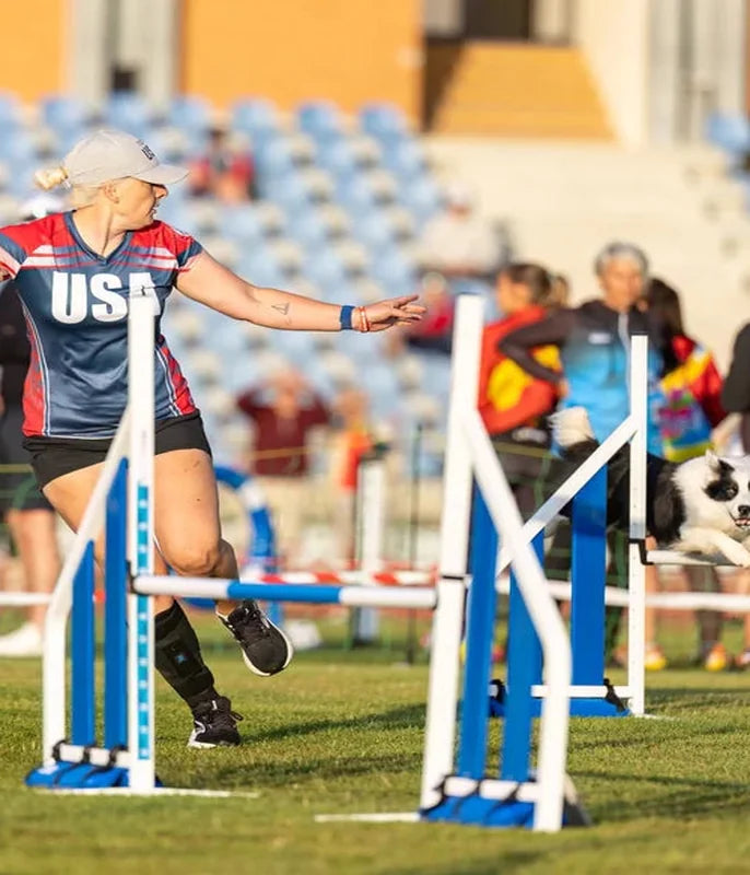 Laurren Bastian running an agility course with her dog